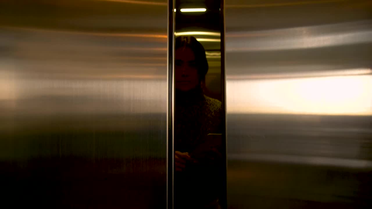 Stock Footage Woman Exits An Elevator Live Wallpaper Free