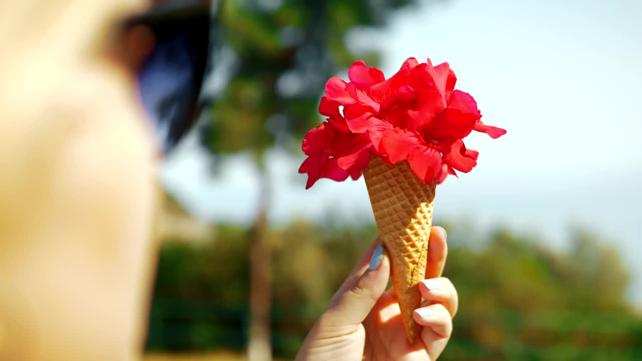 Stock Footage Woman Holding A Waffle Cone With Flowers Live Wallpaper Free