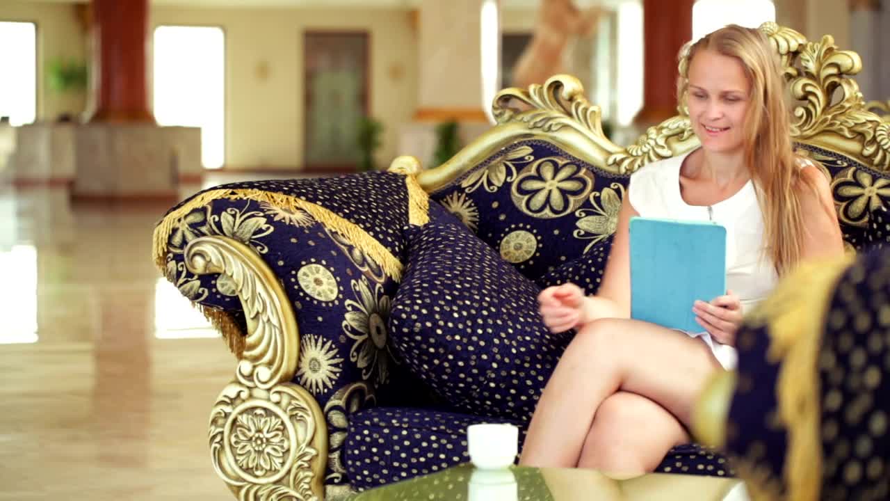 Stock Footage Woman Reading In A Hotel Lobby Live Wallpaper Free