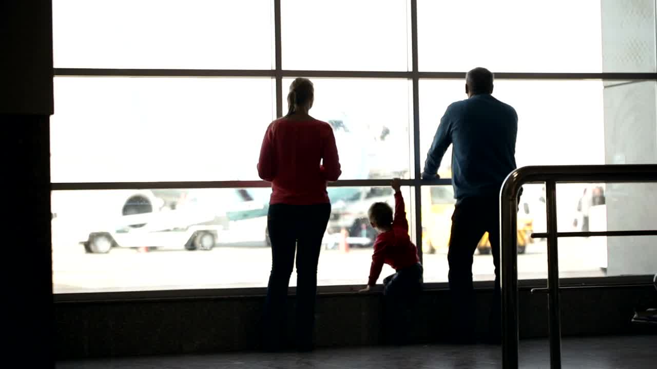 Stock Footage Young Family Waiting For Their Flight Live Wallpaper Free