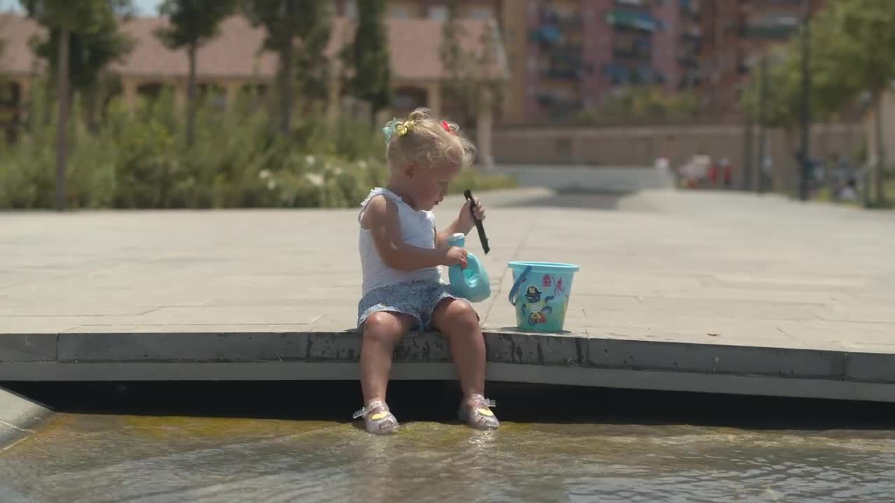 Stock Footage Young Girl Playing In A City Fountain Live Wallpaper Free