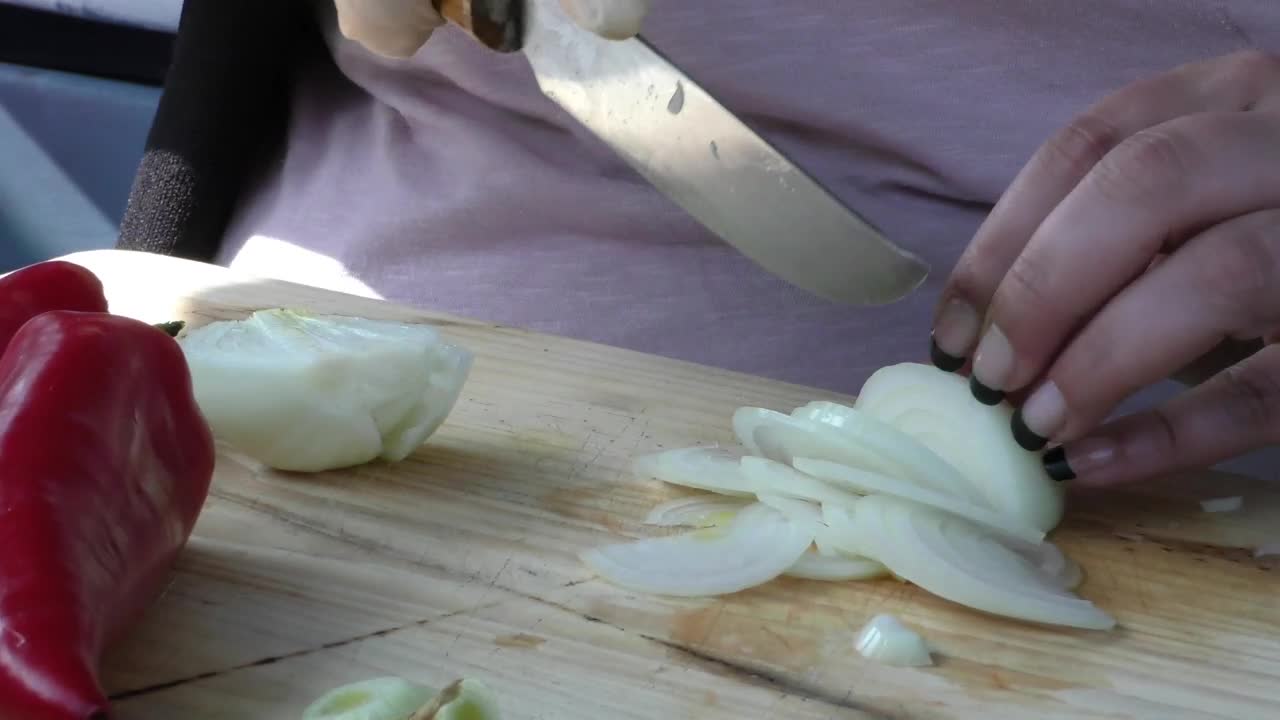 Stock Footage Woman Slicing An Onion On A Board Live Wallpaper Free