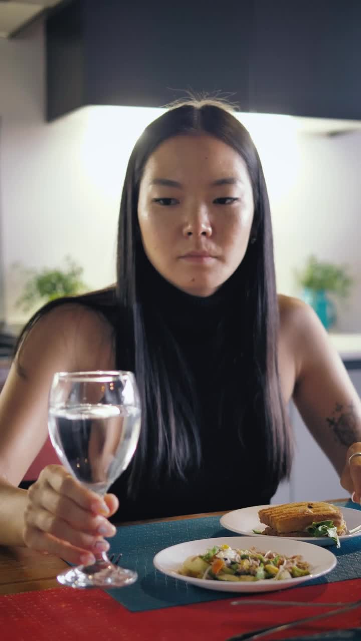 Stock Footage Woman Drinks Water From Her Glass During Her Meal Live Wallpaper Free