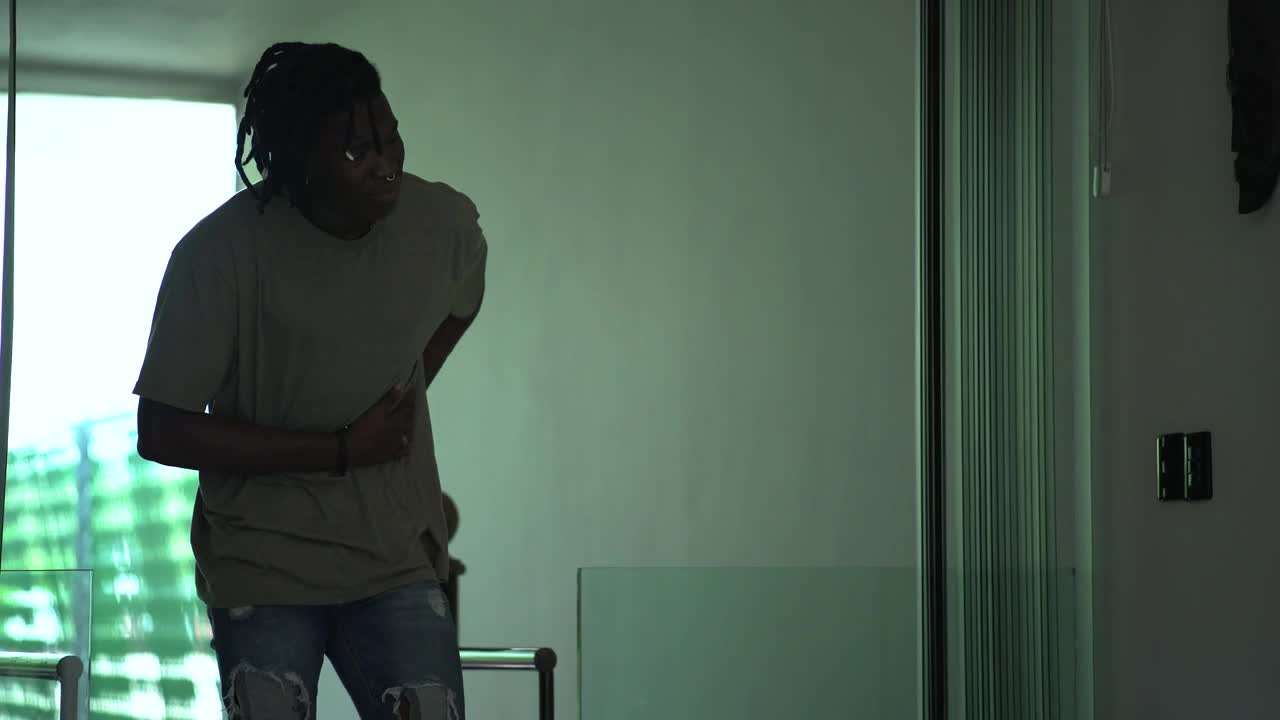 Stock Footage Young Man Lays On A Bed With A Strong Stomach Live Wallpaper Free