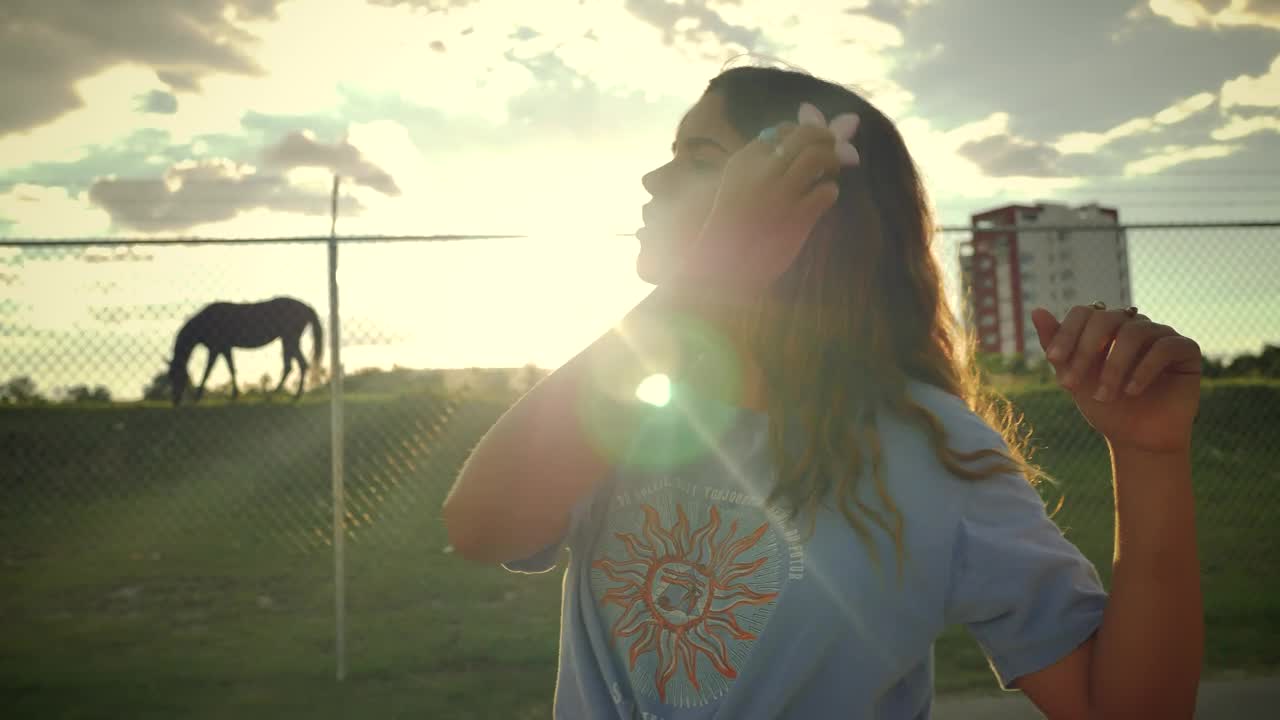 Stock Footage Young Woman Placing A Flower On Her Ear In A Live Wallpaper Free