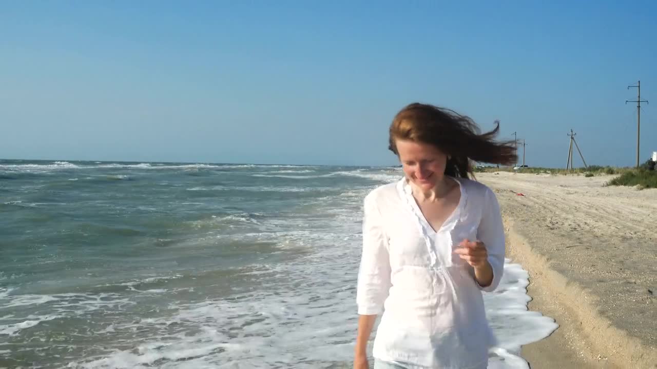 Stock Footage Woman Walking Along The Seashore Live Wallpaper Free