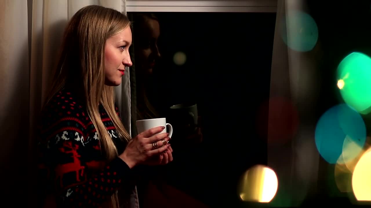 Stock Footage Woman Drinking Coffee By Festive Lights Live Wallpaper Free