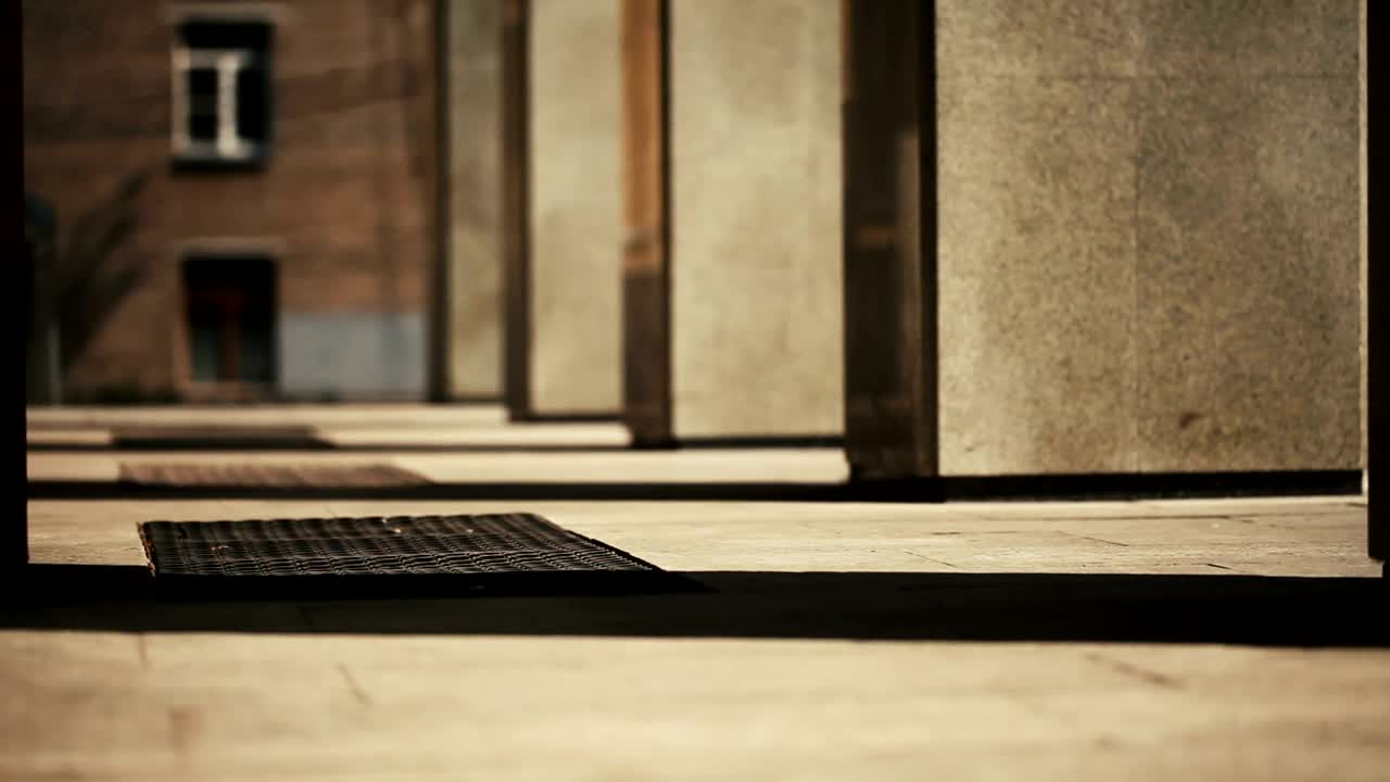 Stock Footage Woman Walking Between Building Columns Live Wallpaper Free