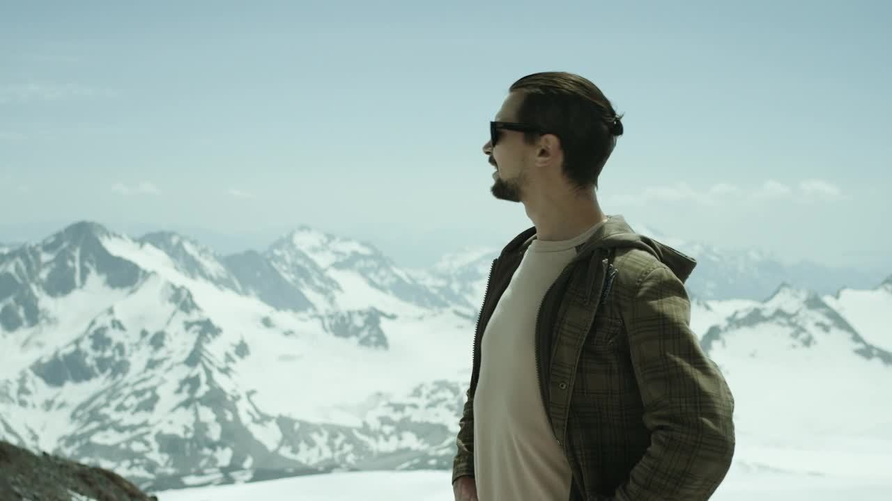 Stock Footage Young Man Standing On A Snow Covered Hill Live Wallpaper Free