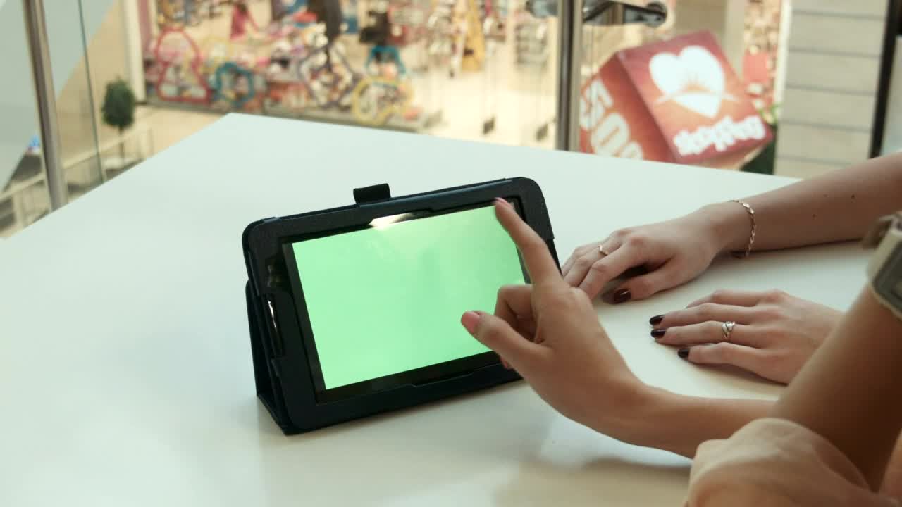 Stock Footage Woman Scrolling On A Tablet In A Shopping Mall Live Wallpaper Free