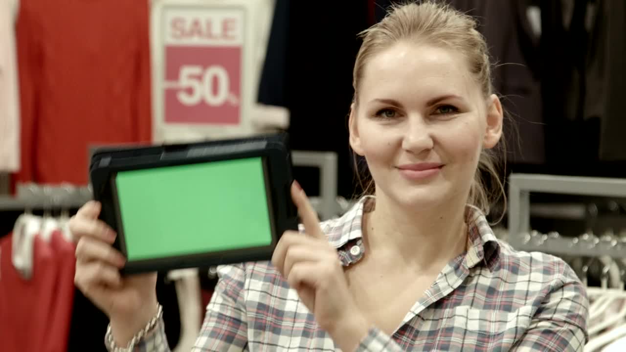 Stock Footage Woman With Green Screen Tablet In Clothing Store Live Wallpaper Free