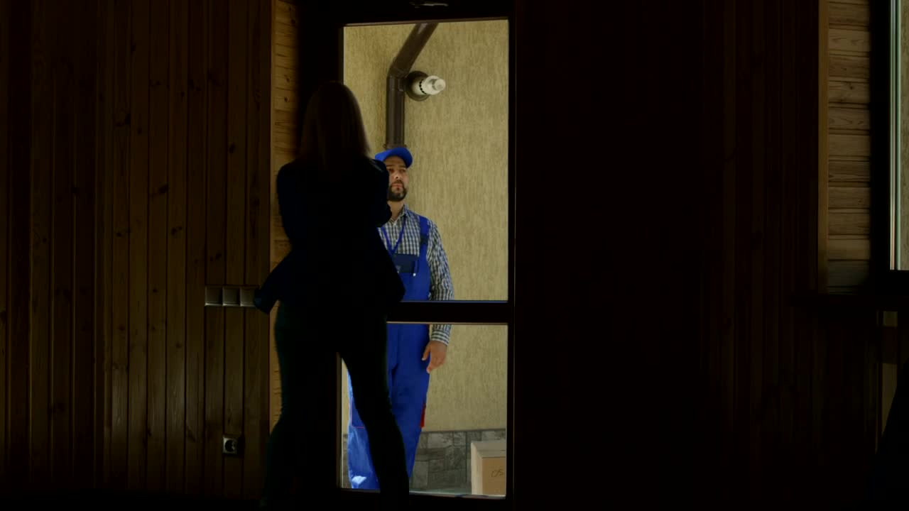 Stock Footage Women Receiving A Package From The Delivery Guy Live Wallpaper Free