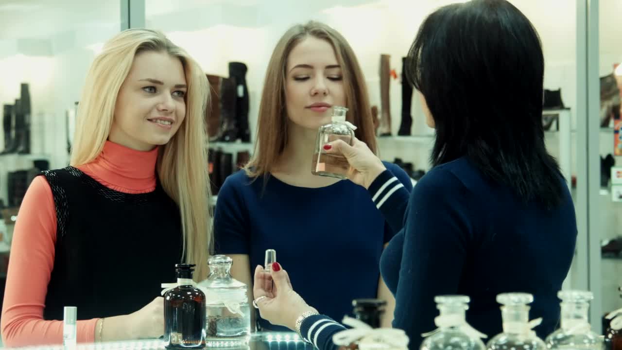 Stock Footage Woman Smelling Perfumes In The Shop Live Wallpaper Free