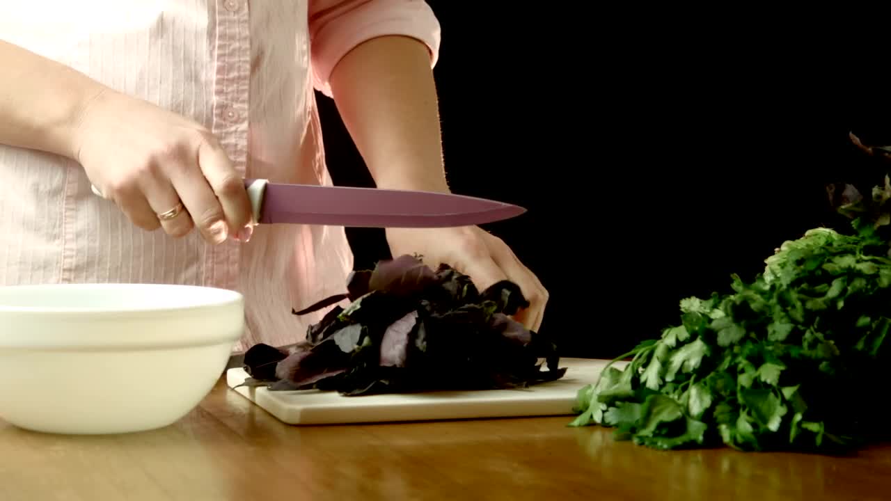 Stock Footage Woman Cutting Herbs In The Kitchen Table Live Wallpaper Free