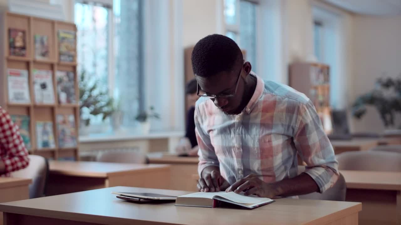 Stock Footage Young Man Studying At The Library Live Wallpaper Free