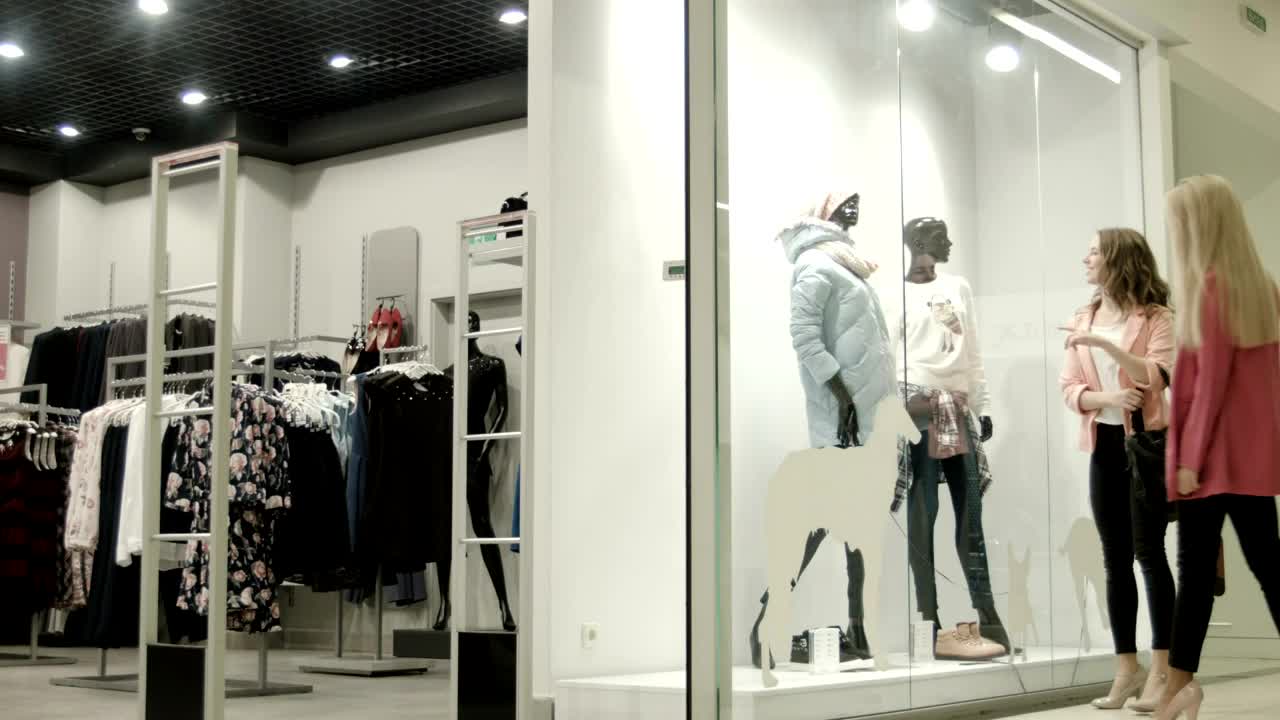 Stock Footage Women Entering The Clothing Store In The Mall Live Wallpaper Free