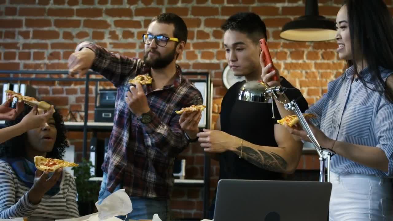 Stock Footage Workers Eating Pizza In The Office Live Wallpaper Free