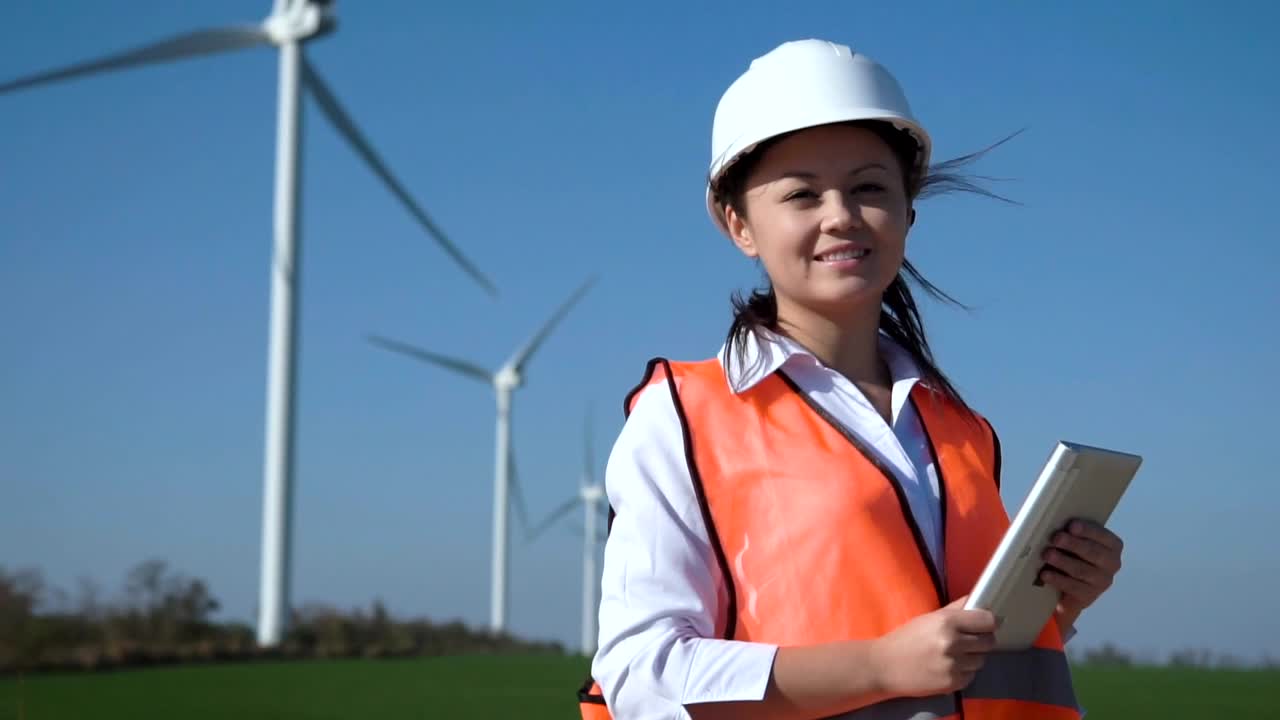 Stock Footage Woman Engineer Is Smiling And Holding A Tablet Live Wallpaper Free