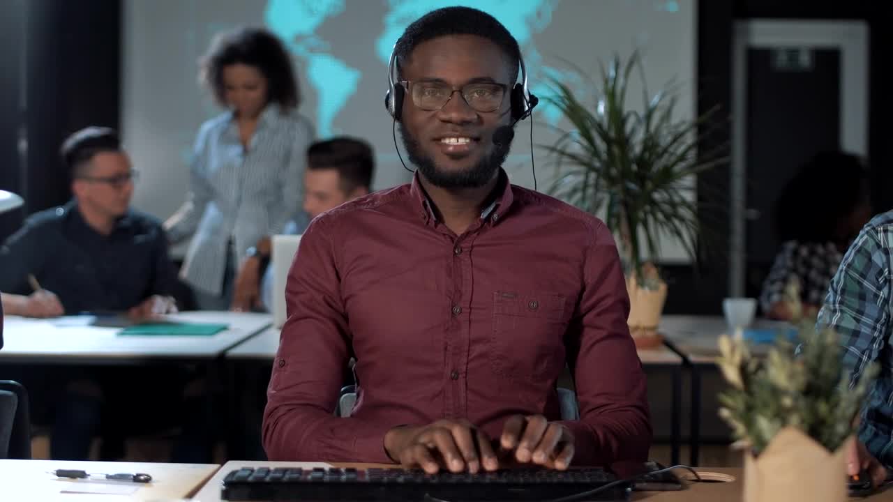 Stock Footage Worker In Front Of The Computer With Headset Live Wallpaper Free