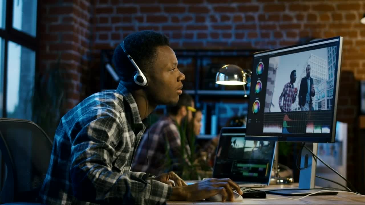 Stock Footage Young Man Working On Video Editing At The Office Live Wallpaper Free