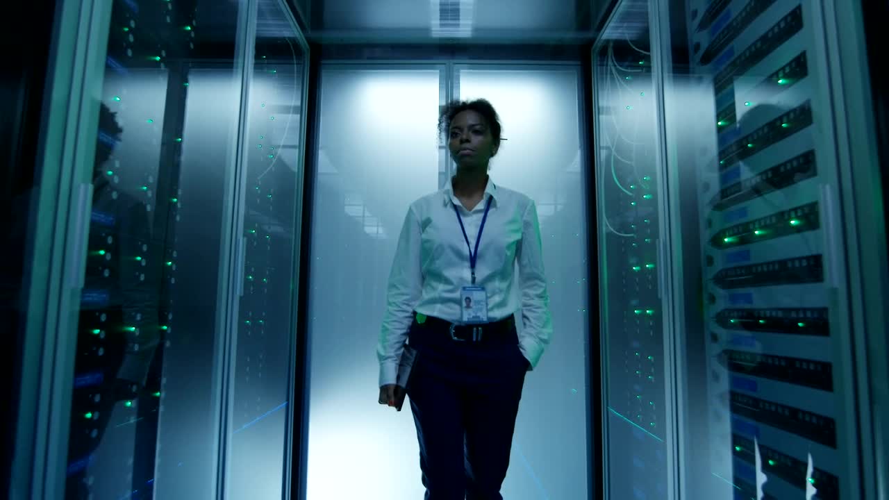 Stock Footage Young Woman Walking In Server Hallway Live Wallpaper Free