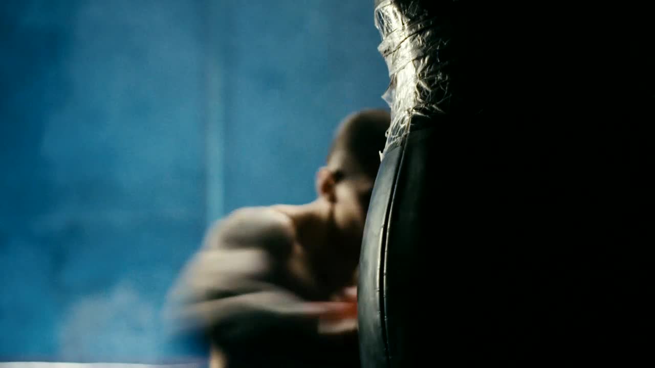 Stock Footage Young Man Hitting The Punching Bag At A Gym Live Wallpaper Free