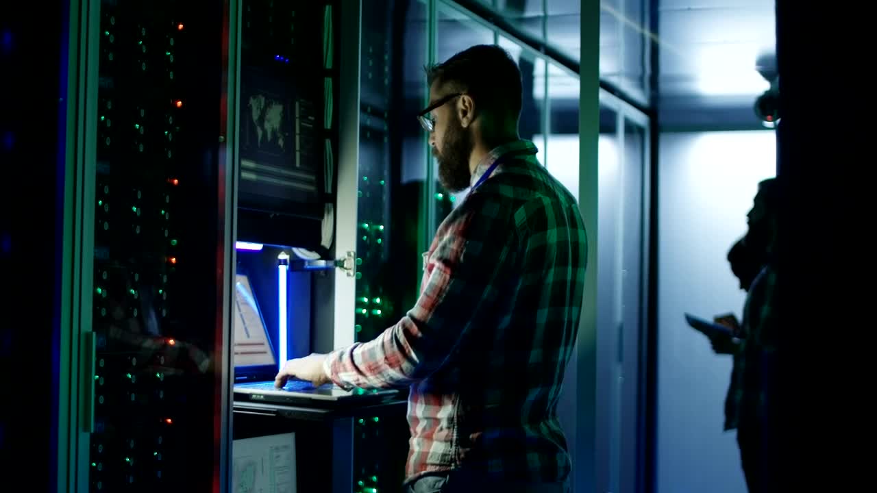 Stock Footage Young Engineers Working On Server Room Live Wallpaper Free