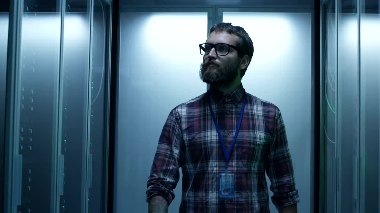 Stock Footage Young It Specialist Working On A Server Room Live Wallpaper Free