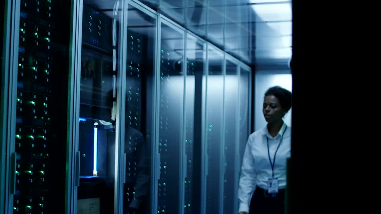 Stock Footage Woman On Server Room Logs Into The Computer Live Wallpaper Free
