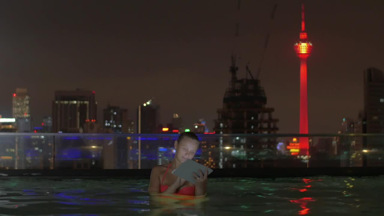 Stock Footage Woman Sitting In An Infinity Pool Live Wallpaper Free
