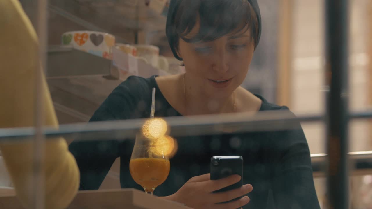 Stock Footage Woman Smiling As She Checks Her Phone Live Wallpaper Free