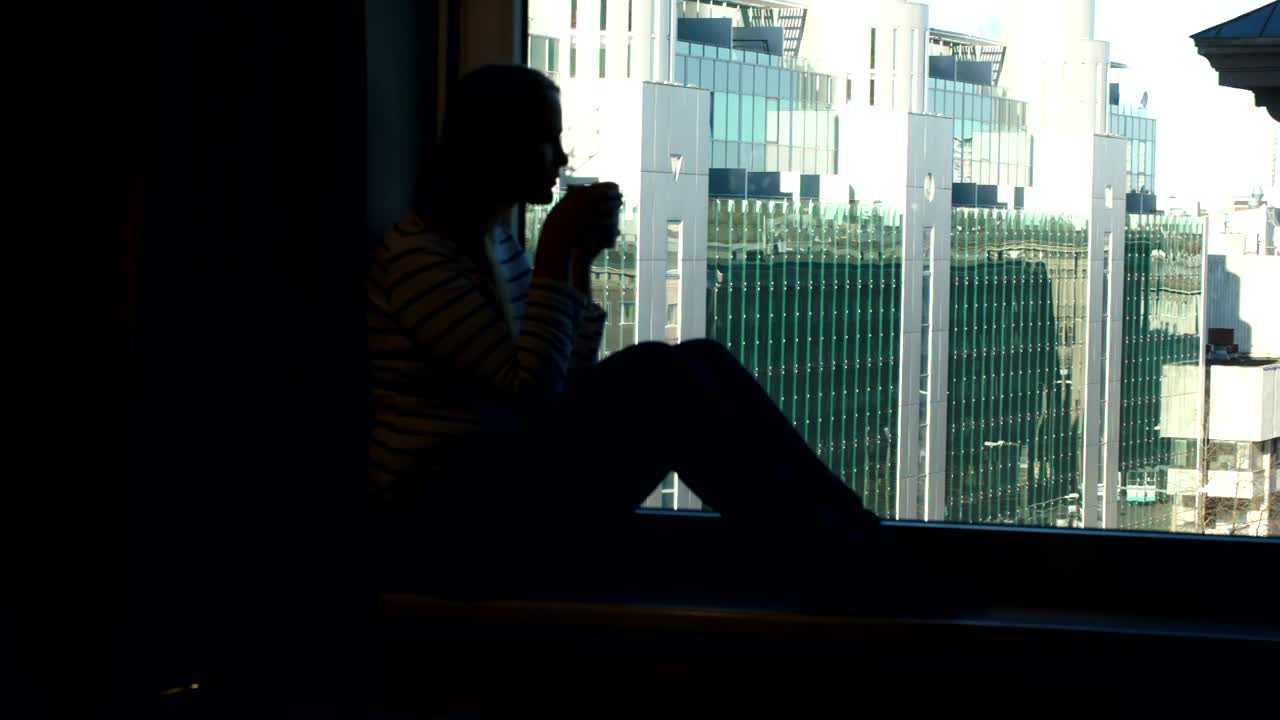 Stock Footage Woman Drinking Coffee In A Dark Room Live Wallpaper Free