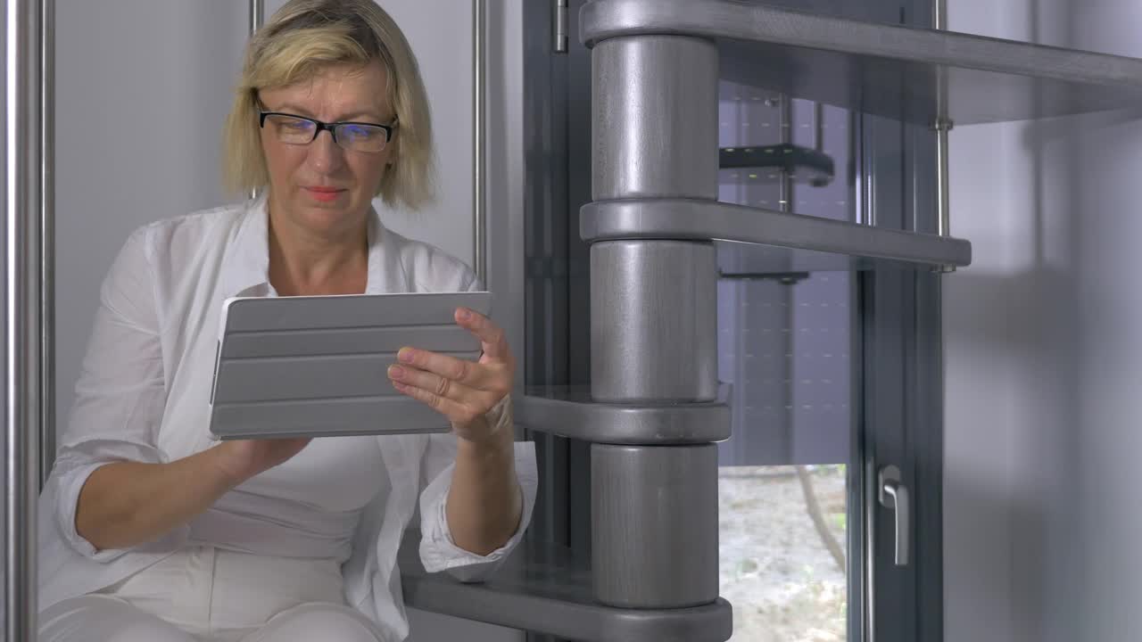 Stock Footage Woman With Glasses Using A Tablet Live Wallpaper Free