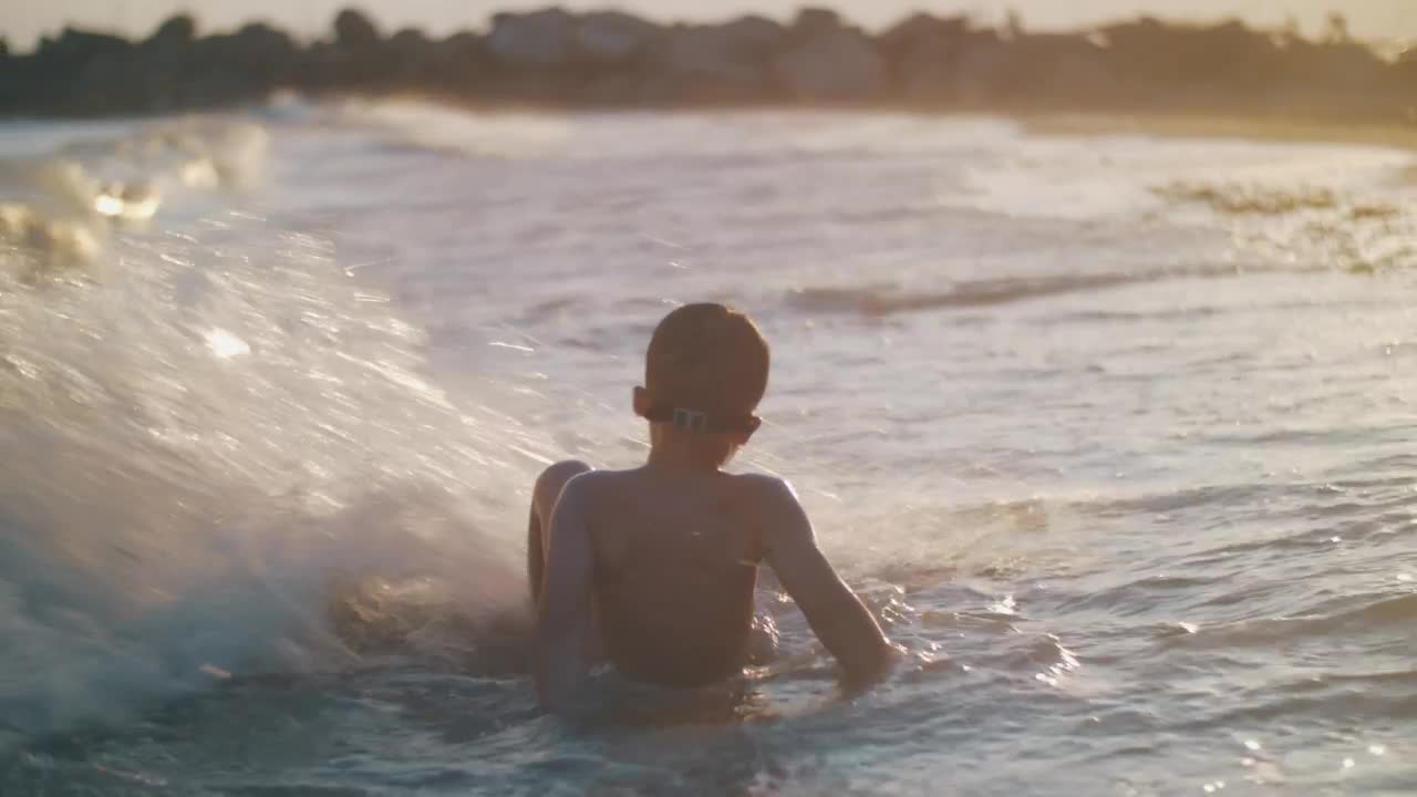 Stock Footage Young Boy Playing In The Waves Live Wallpaper Free