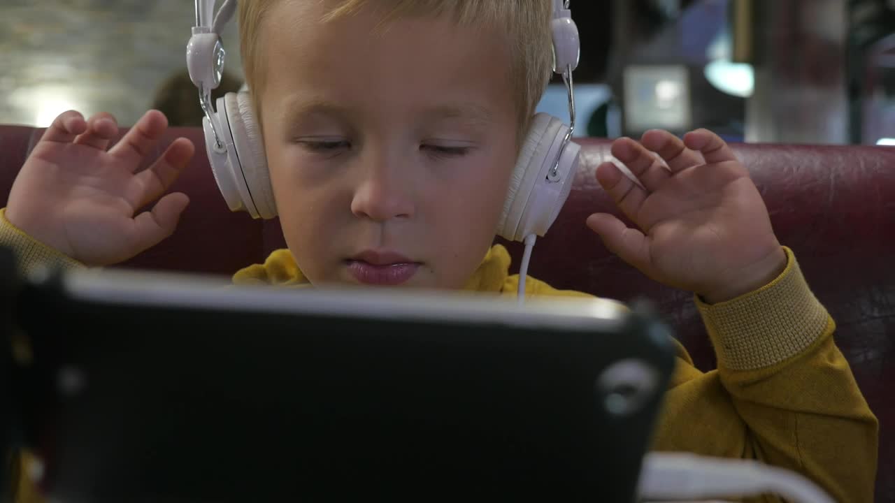 Stock Footage Young Boy Watching Cartoons On A Tablete Live Wallpaper Free