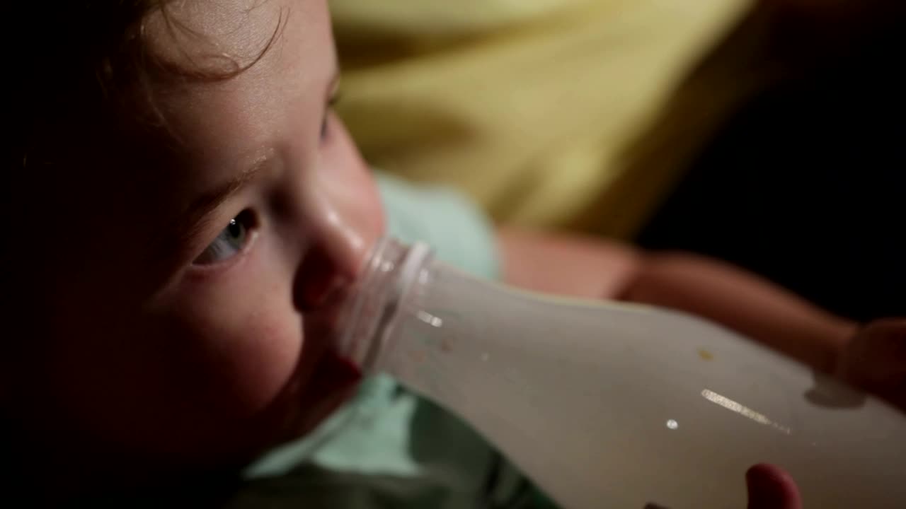 Stock Footage Young Child Drinking From A Bottle Live Wallpaper Free