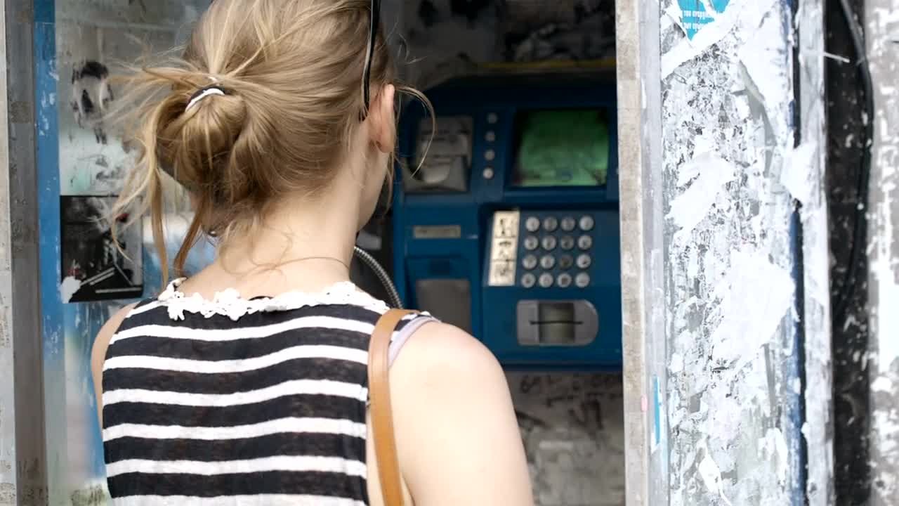 Stock Footage Woman Using A Public Telephone Live Wallpaper Free