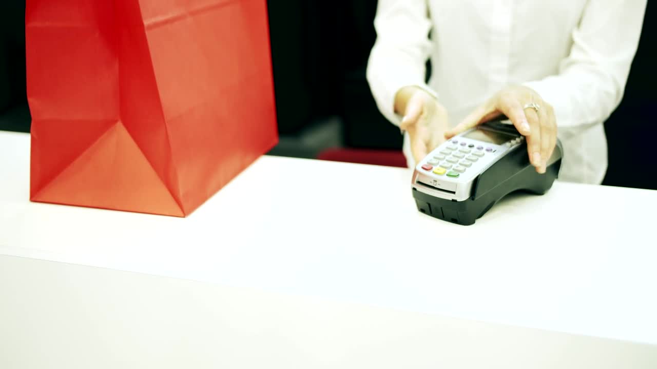Stock Footage Woman Pays Cashier With Credit Card In Shop Live Wallpaper Free