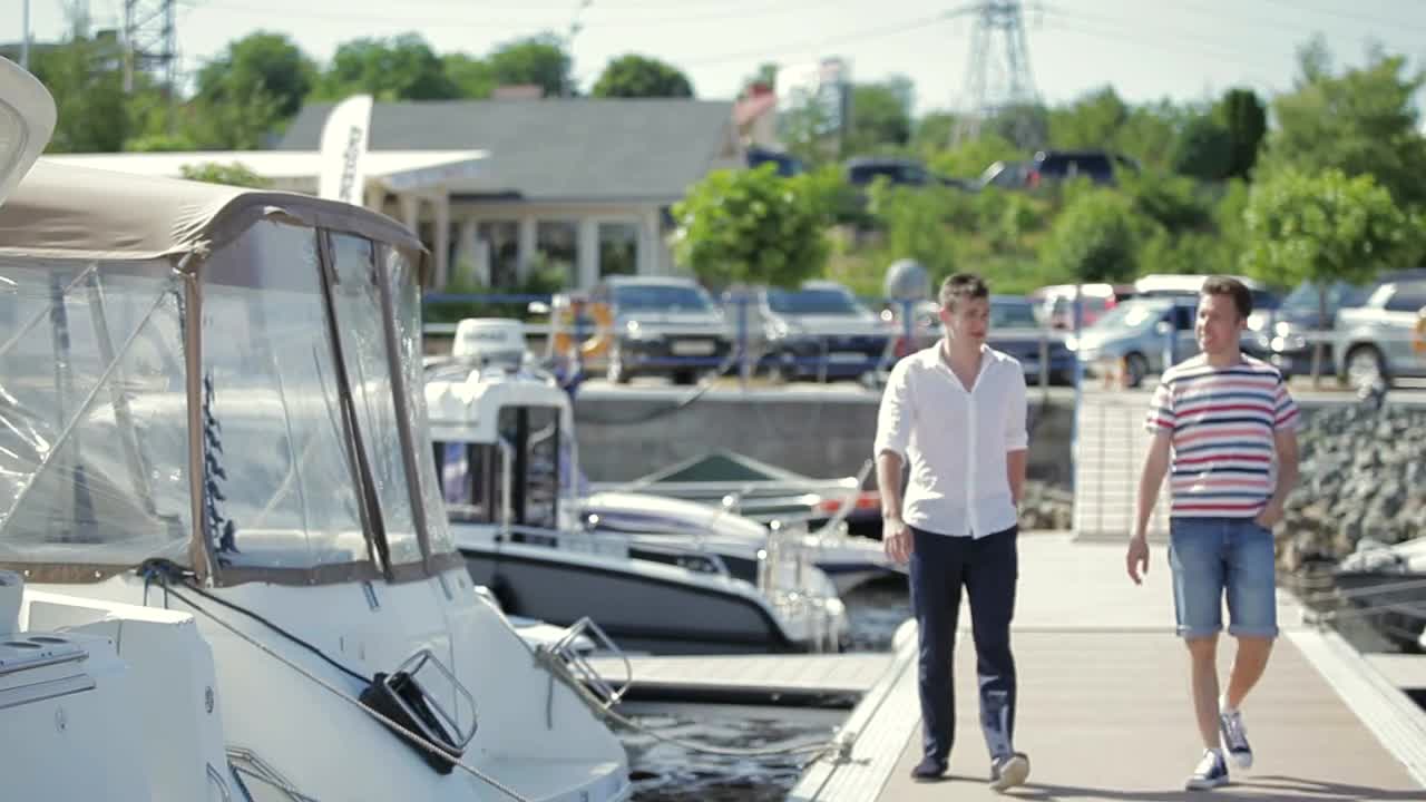 Stock Footage Yacht Salesman With A Young Customer Live Wallpaper Free