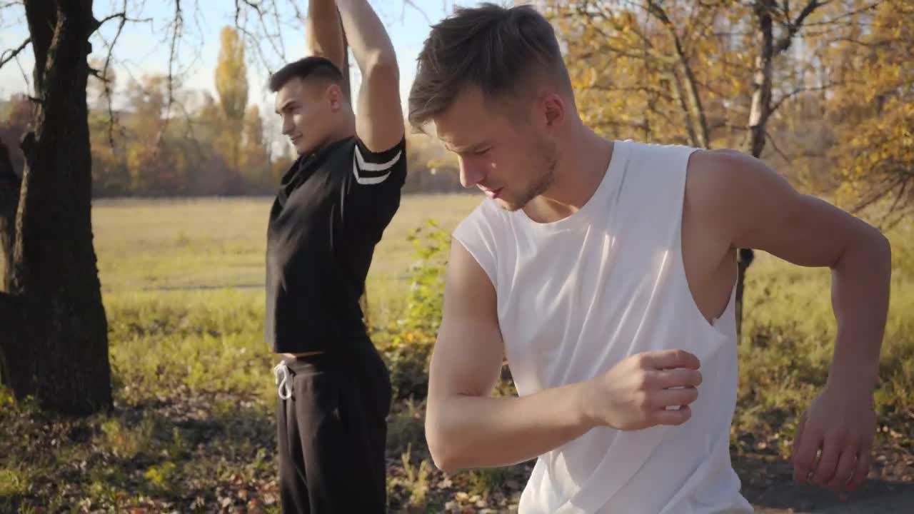 Stock Footage Young Strong Men Warming Up Before Jogging Live Wallpaper Free