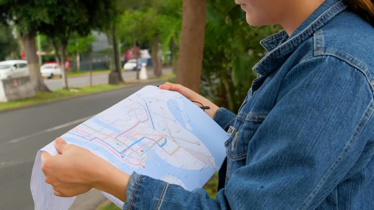 Stock Footage Woman On The Street Locating Herself With A Map Of Live Wallpaper Free