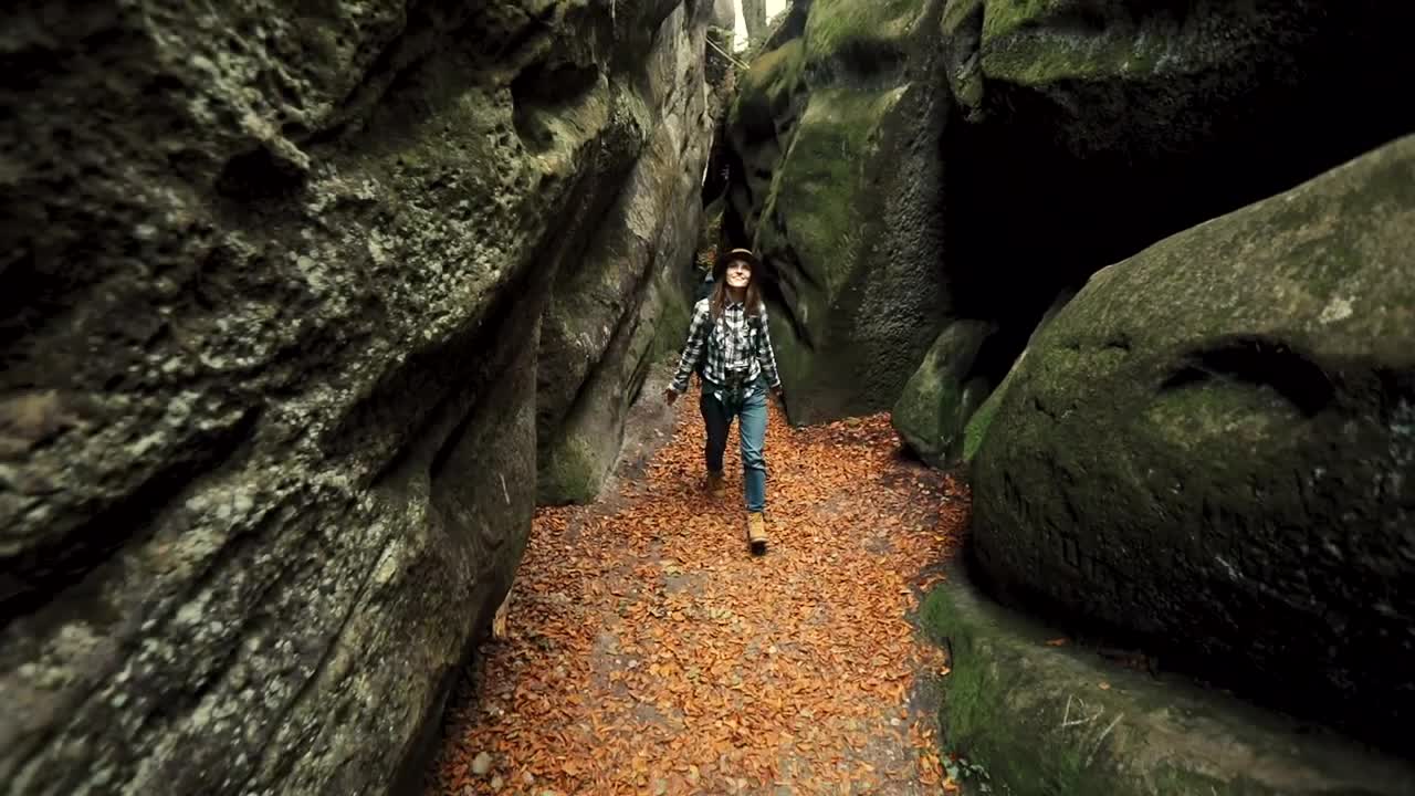 Stock Footage Woman Exploring A Cave In The Forest Live Wallpaper Free