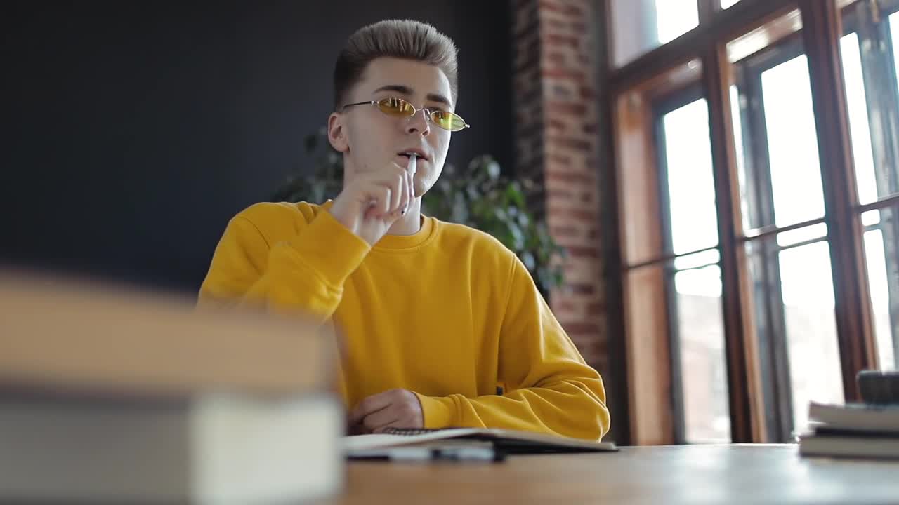 Stock Footage Young Student Writing In A Notebook Live Wallpaper Free