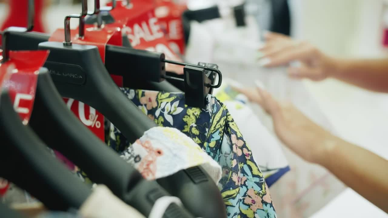 Stock Footage Woman Looking At Discounted Clothes Live Wallpaper Free