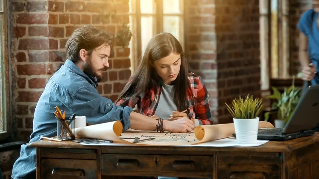 Stock Footage Work Team Planning A Project On Blueprints Live Wallpaper Free