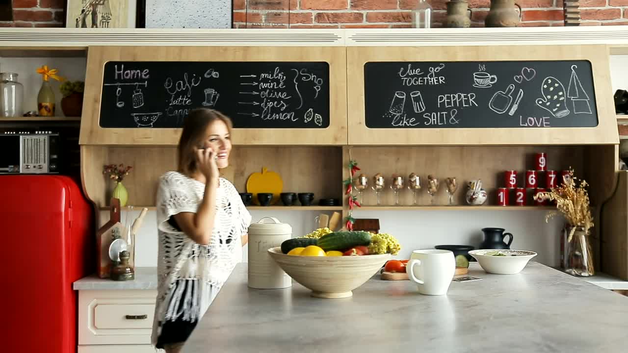 Stock Footage Woman Talking On The Phone In Her Kitchen Live Wallpaper Free