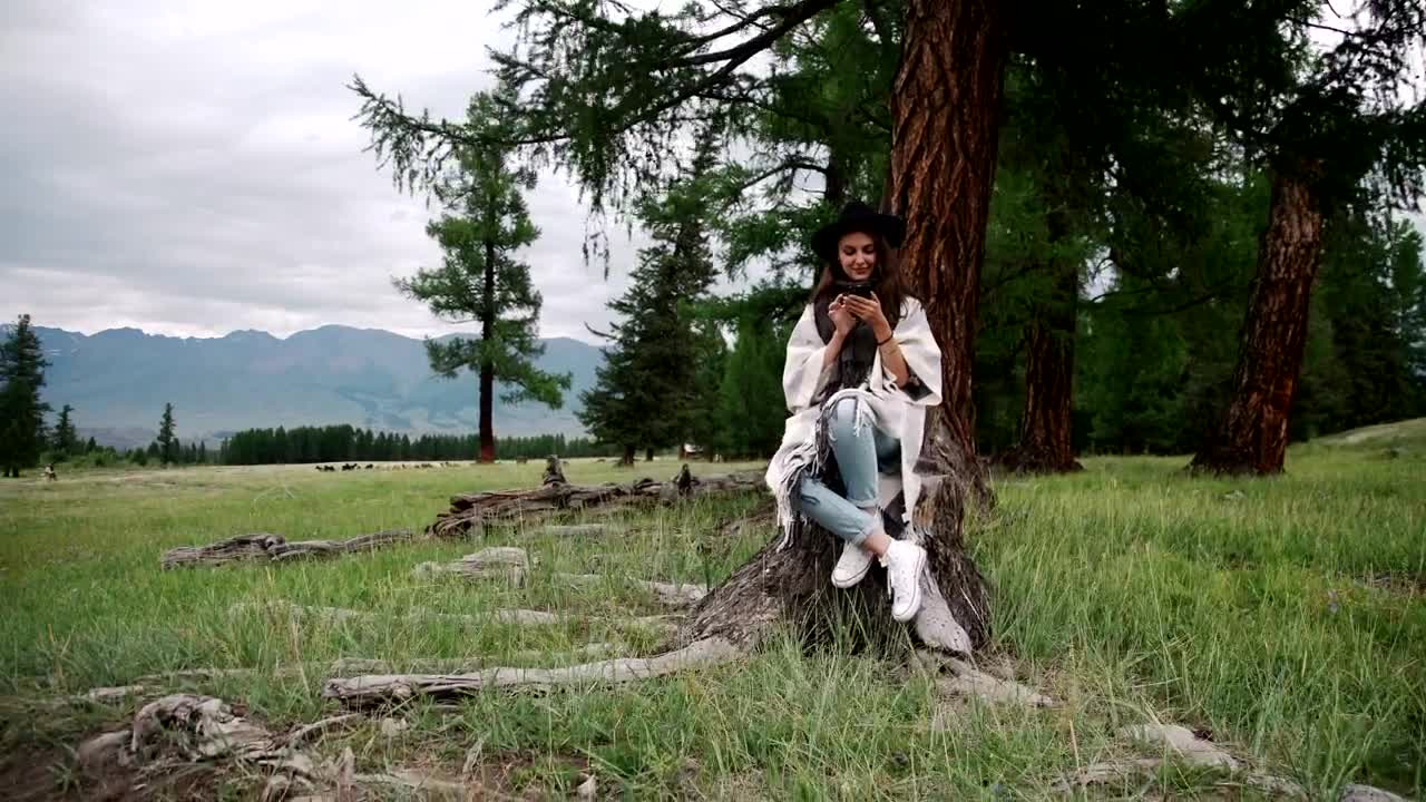 Stock Footage Woman Looking At Her Mobile In Nature Live Wallpaper Free