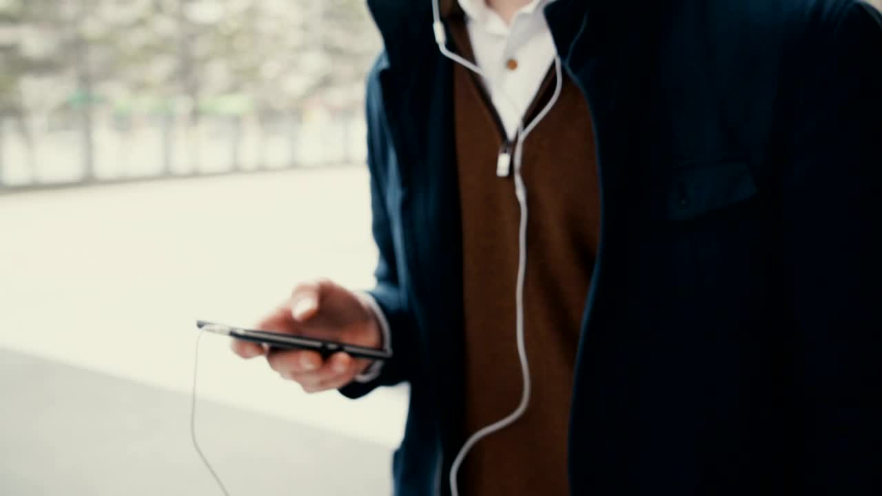 Stock Footage Young Student Listening To Music From His Mobile Live Wallpaper Free