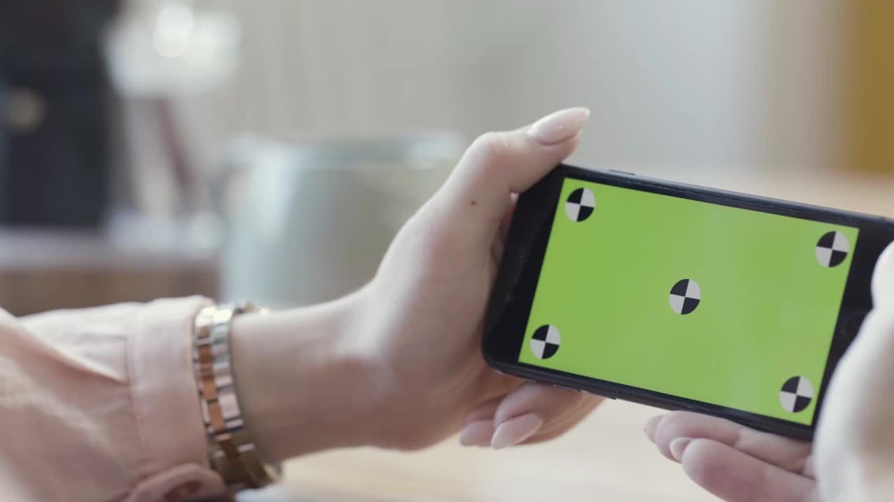 Stock Footage Woman Holding A Smartphone Sideways Live Wallpaper Free