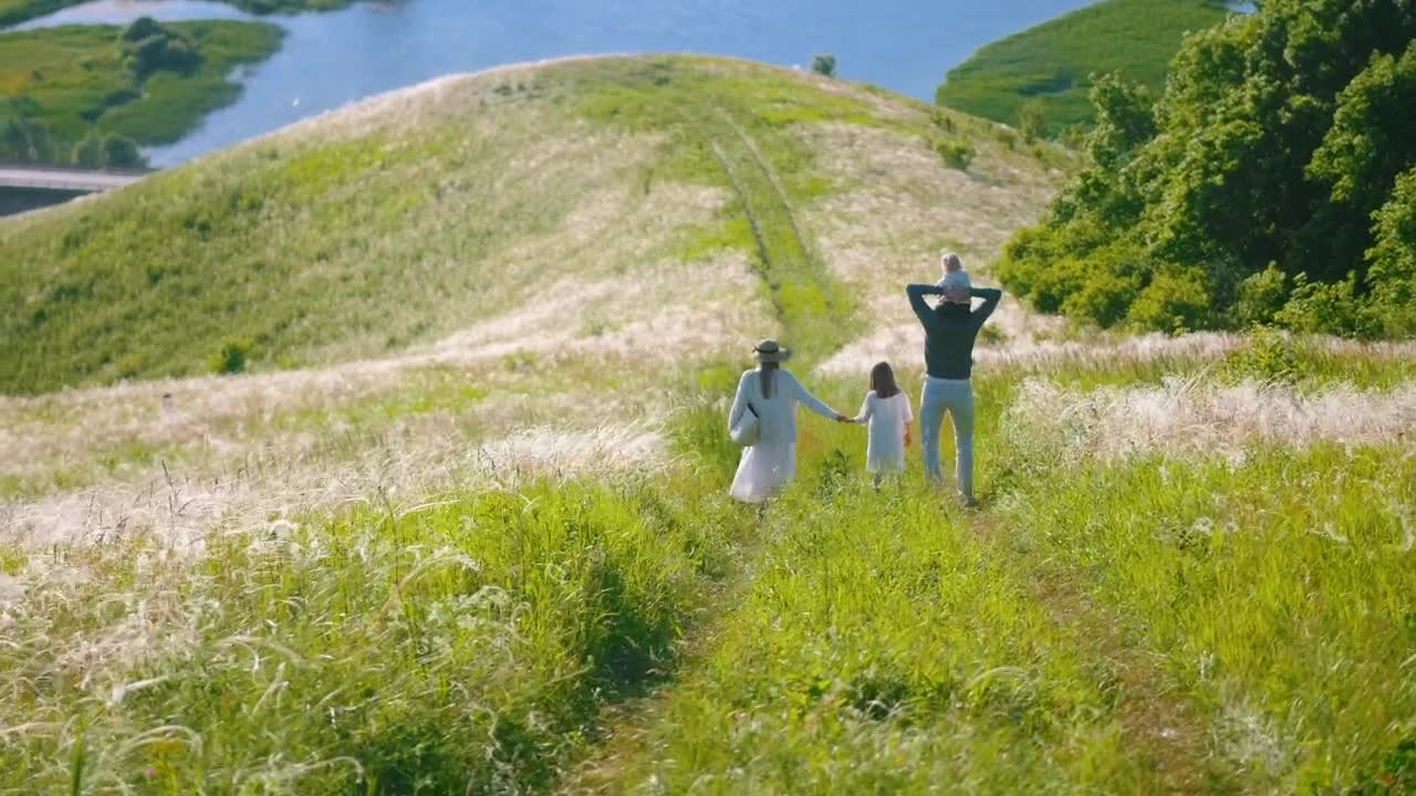 Stock Footage Young Family Walking On A Road At The Hill Live Wallpaper Free